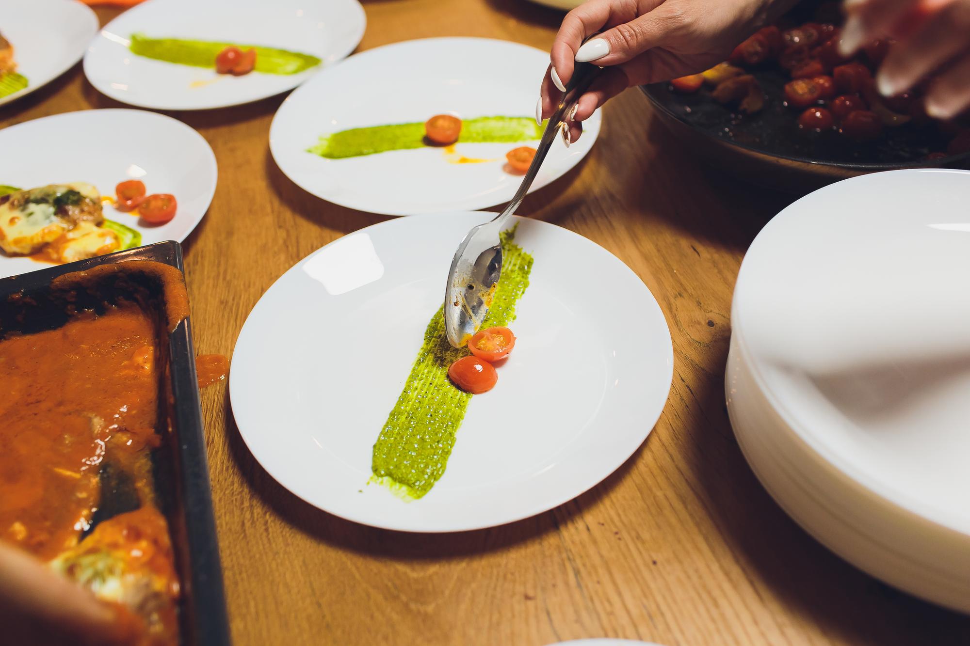 Selection of plated dishes on wooden table